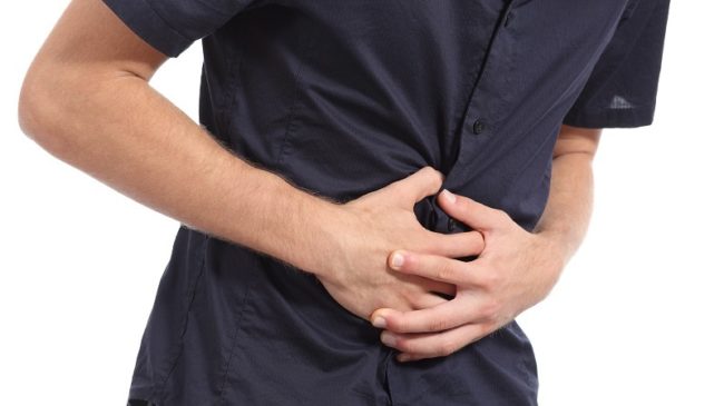 Casual man with stomach ache