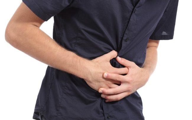 Casual man with stomach ache