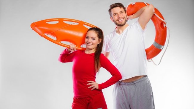 lifeguard couple with rescue equipment
