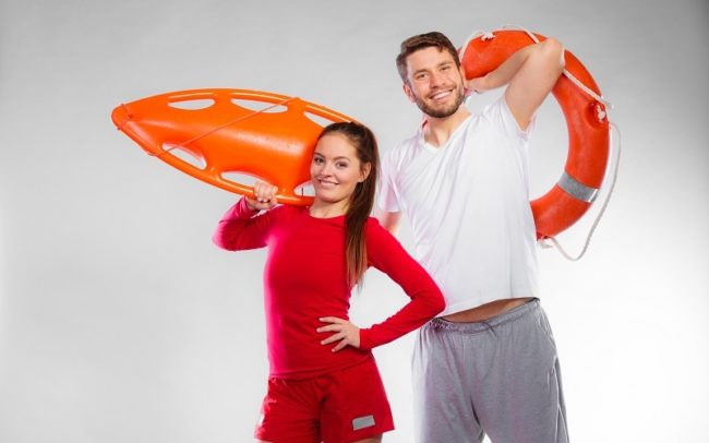 lifeguard couple with rescue equipment