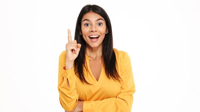 Amazing happy young lady in yellow shirt have an idea.