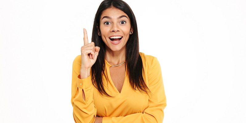 Amazing happy young lady in yellow shirt have an idea.