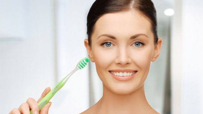 woman with toothbrush